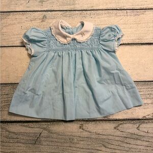 Vintage blue baby dress with smocking and a Peter Pan collar. Size 6-12